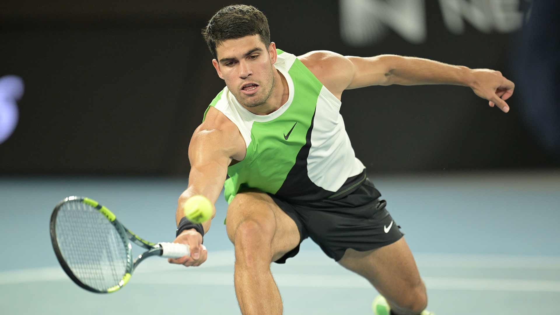 Carlos Alcaraz begins his quest to complete the career Grand Slam at the Australian Open with a straight-sets win Sunday night.