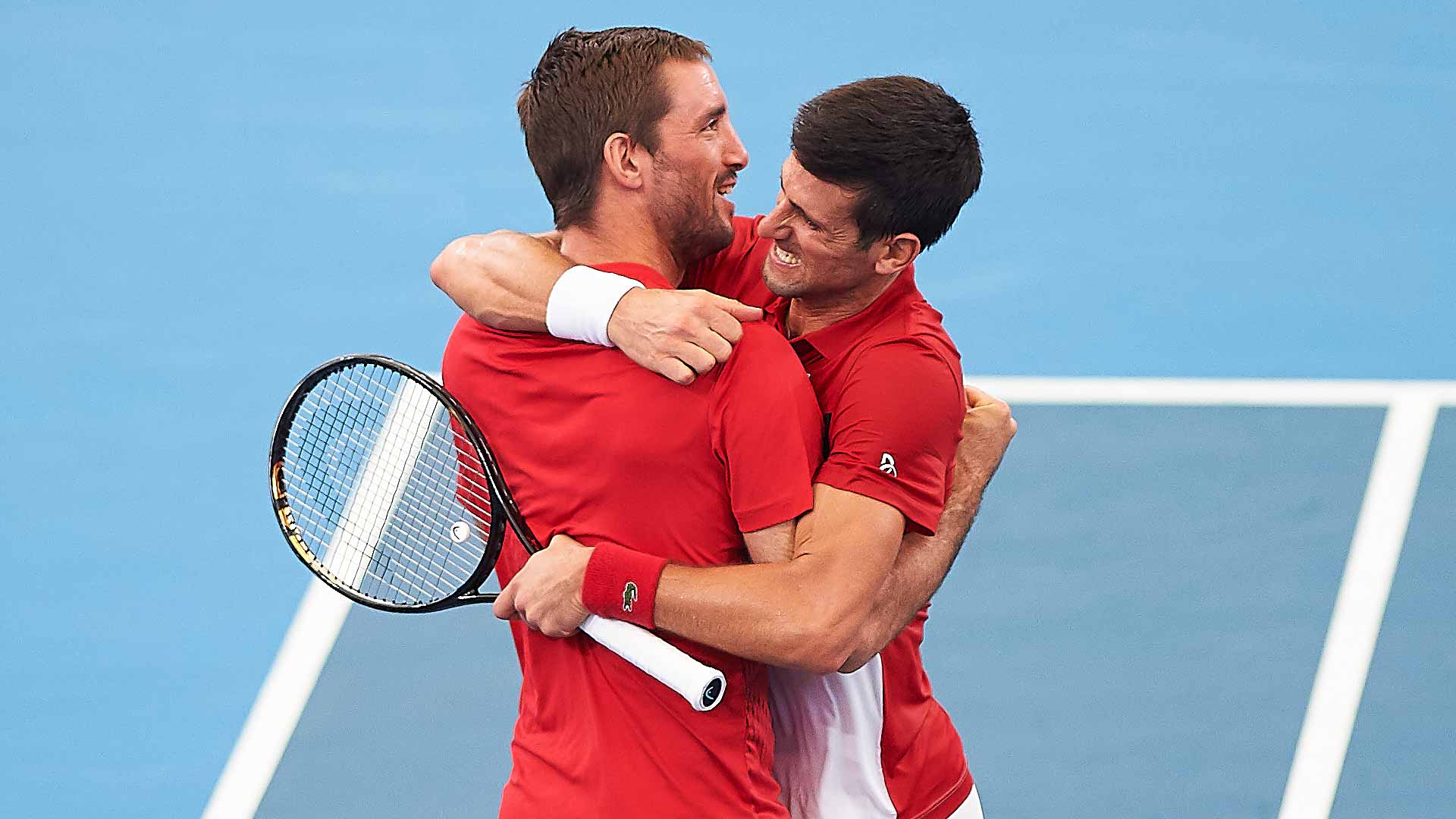 Viktor Troicki and Novak Djokovic celebrate during Serbia's run to the 2020 ATP Cup title.